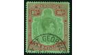 SG119b. 1942 10/- Yellow green and carmine. Ordinary paper. Line